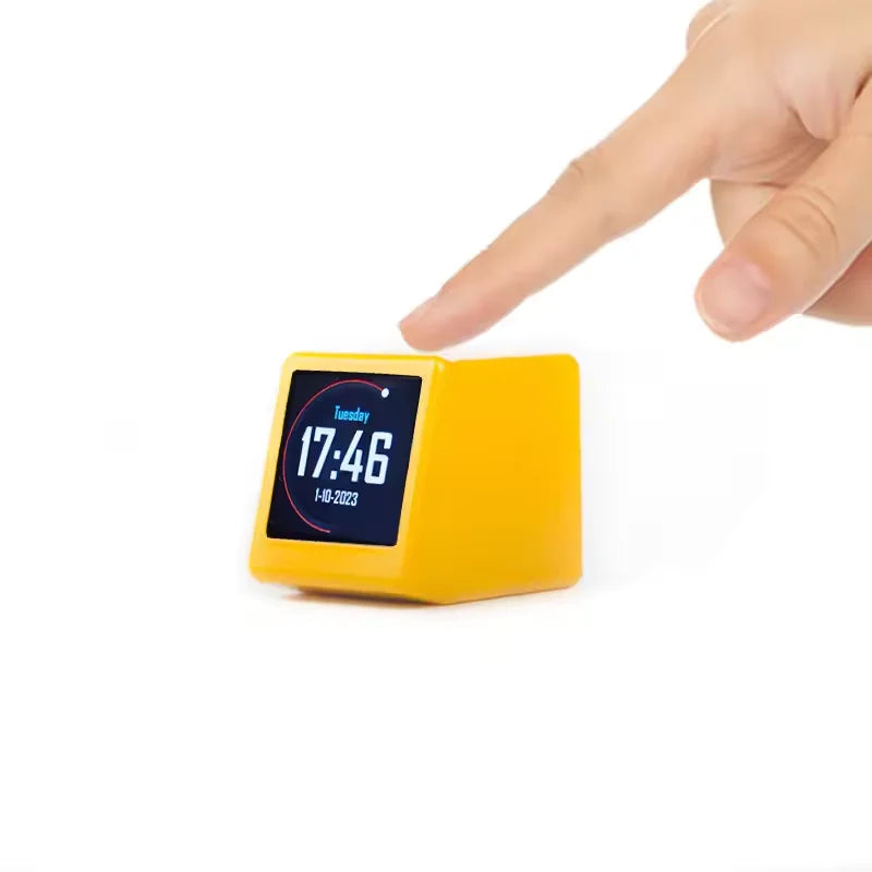 Yellow digital clock with a hand pressing a button on a white background