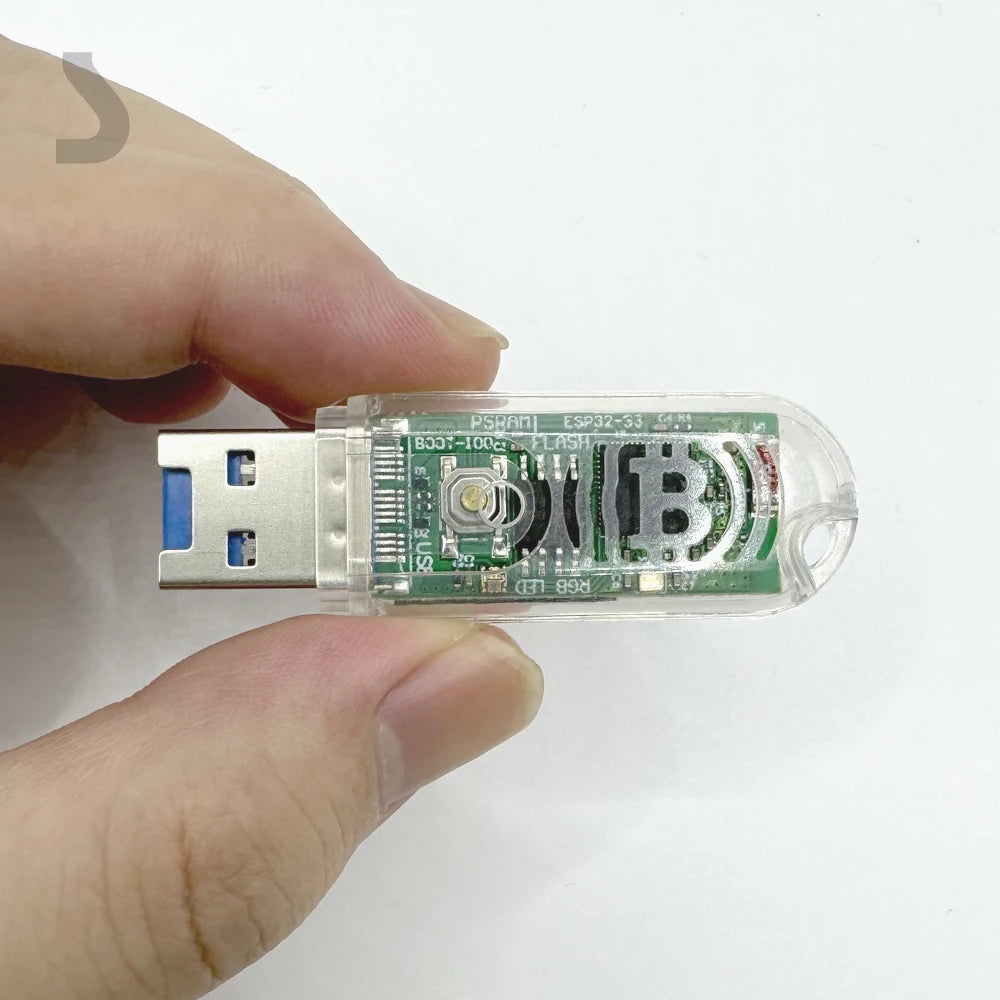 Hand holding a USB device with Bitcoin symbol on a white background