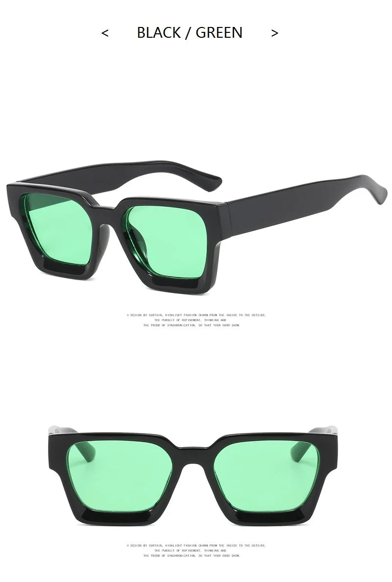 Black-framed sunglasses with green lenses on a white background