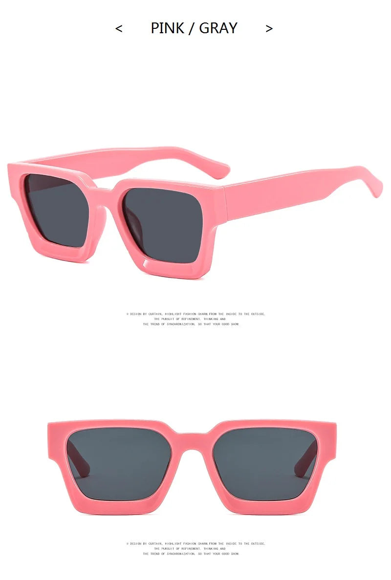 Pink sunglasses with dark lenses on a white background