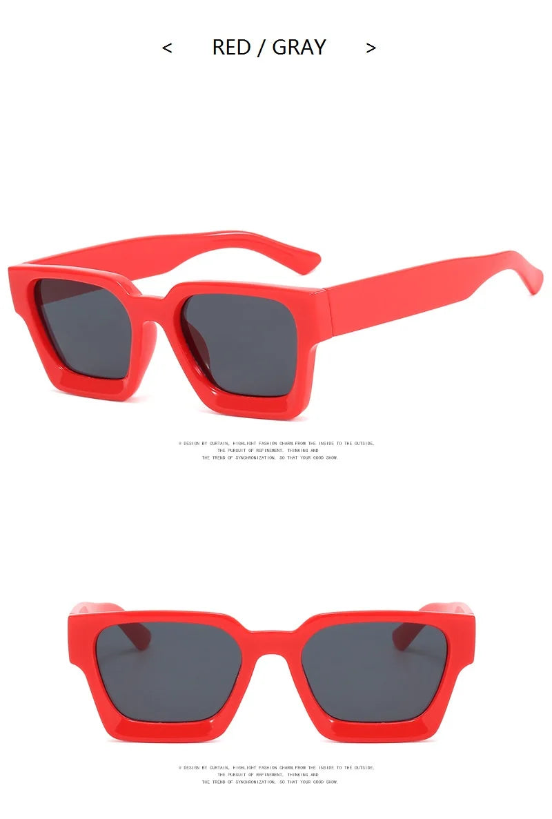 Red sunglasses with dark lenses on a white background