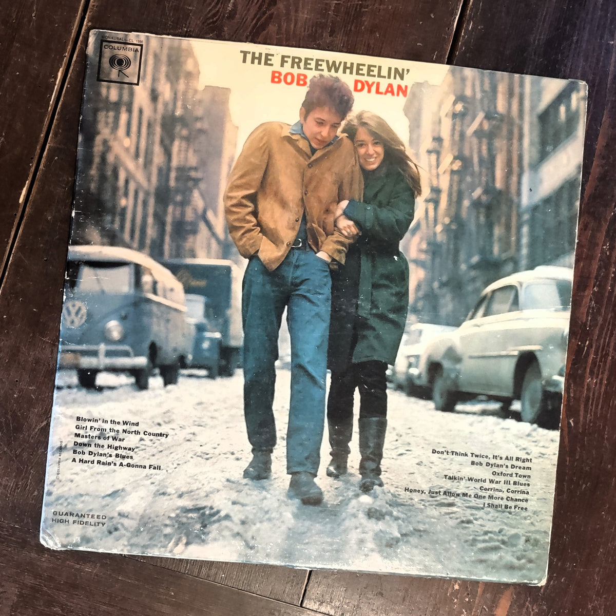 Image of The Freewheelin' Bob Dylan Vinyl Record featuring the full front cover over woodgrain background.