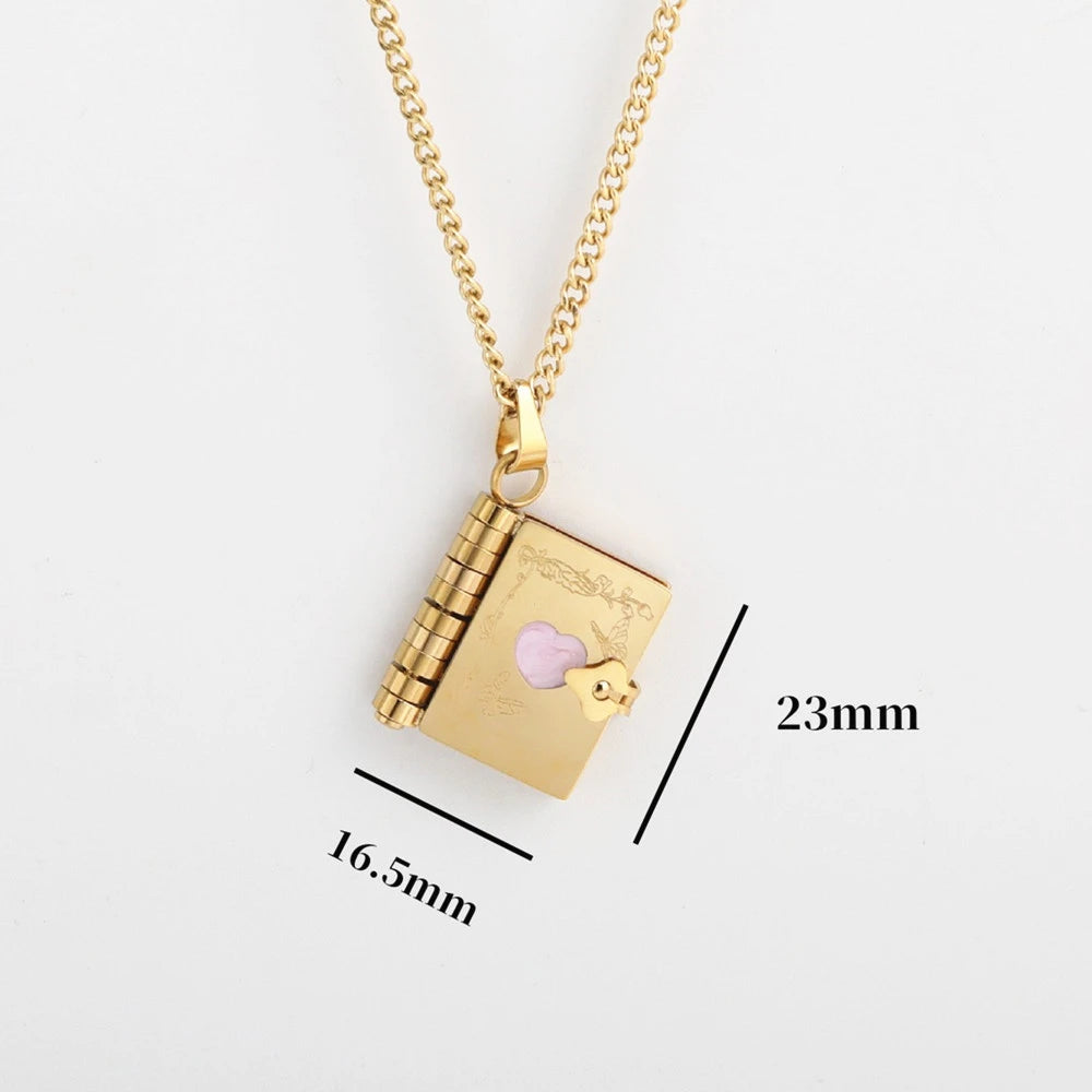 Gold necklace with a book-shaped pendant with size chart, on a white background.