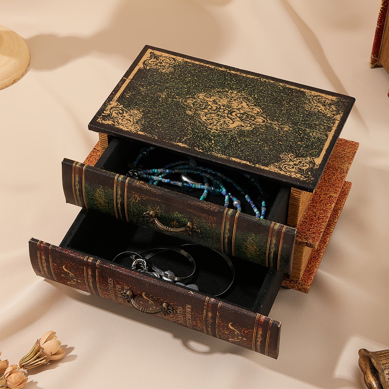 Decorative jewelry box with jewelry inside on a light background