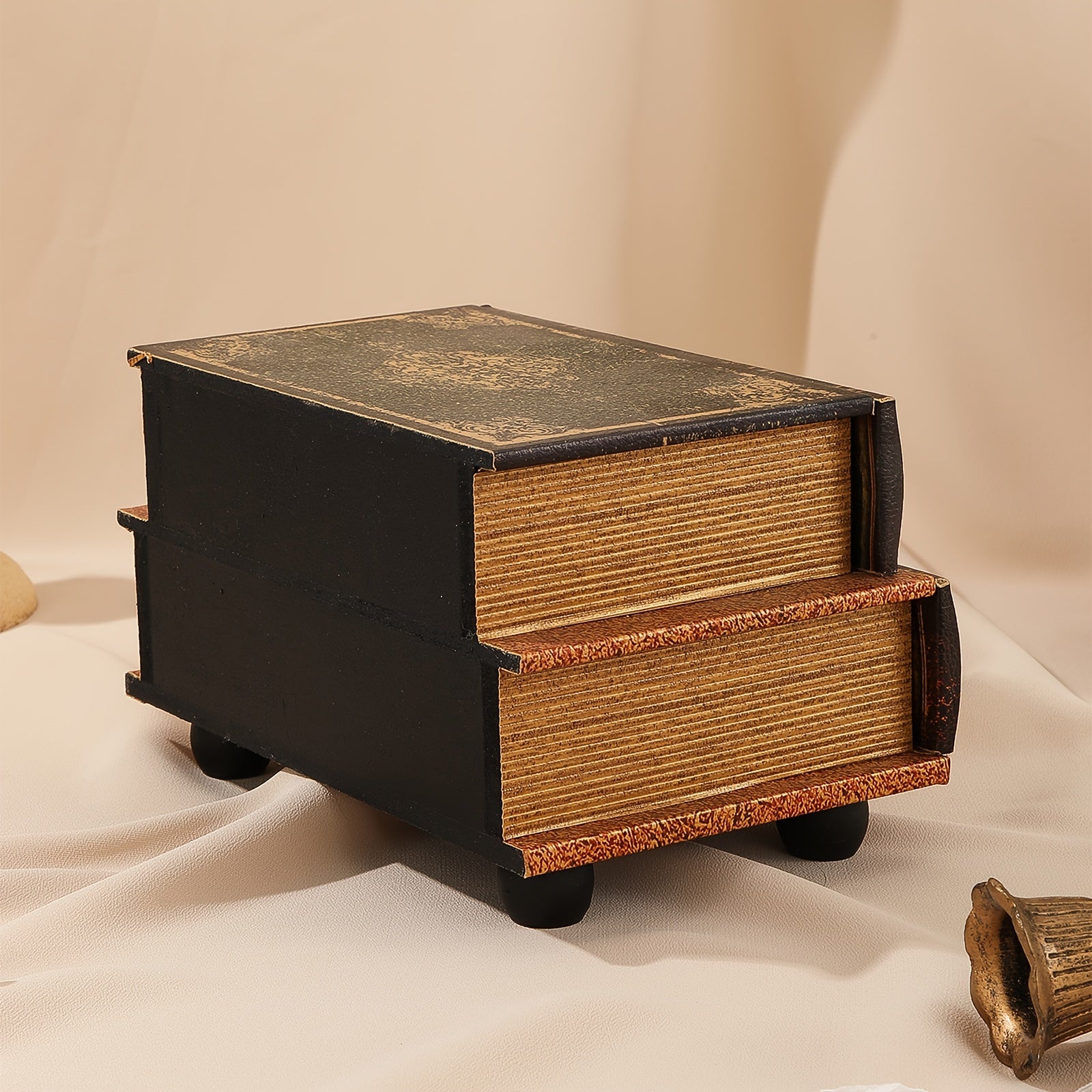 Small wooden chest with two drawers on a beige background