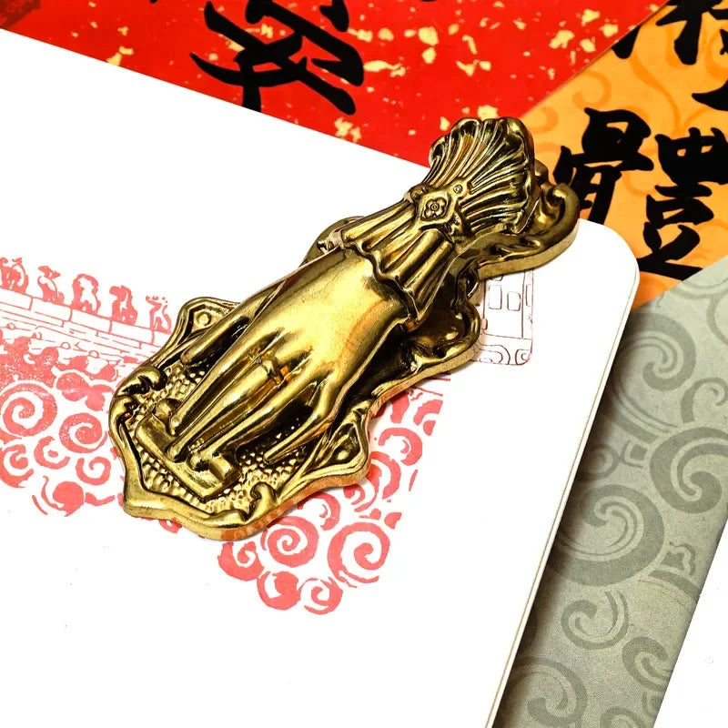 Vintage gilded brass hand-shaped notebook clip for book decoration.