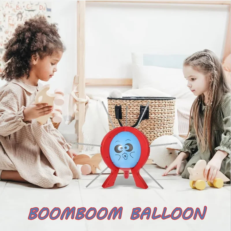Two children playing with a toy called 'Boomboom Balloon' in a room.