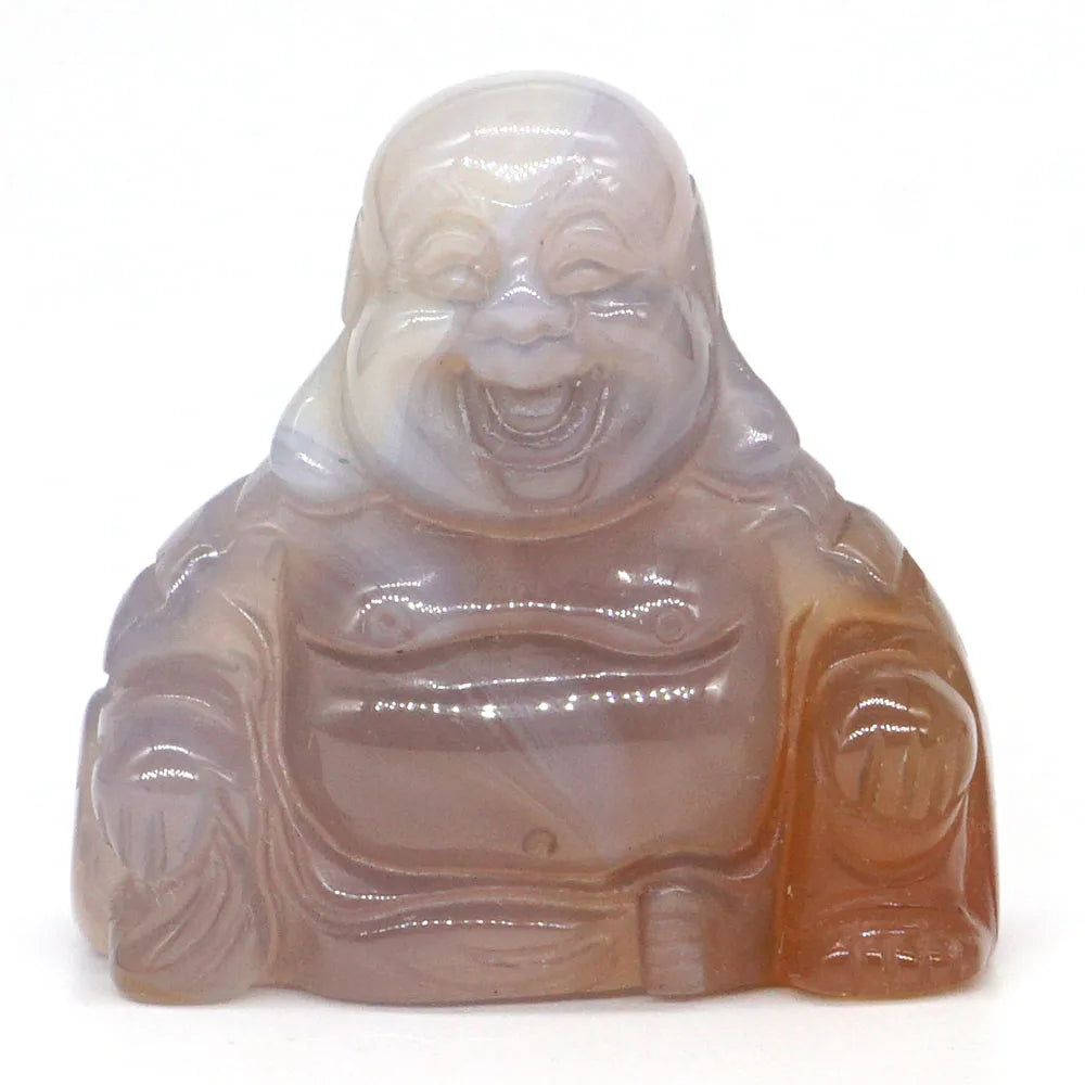 Carved agate stone laughing Buddha figure on a white background