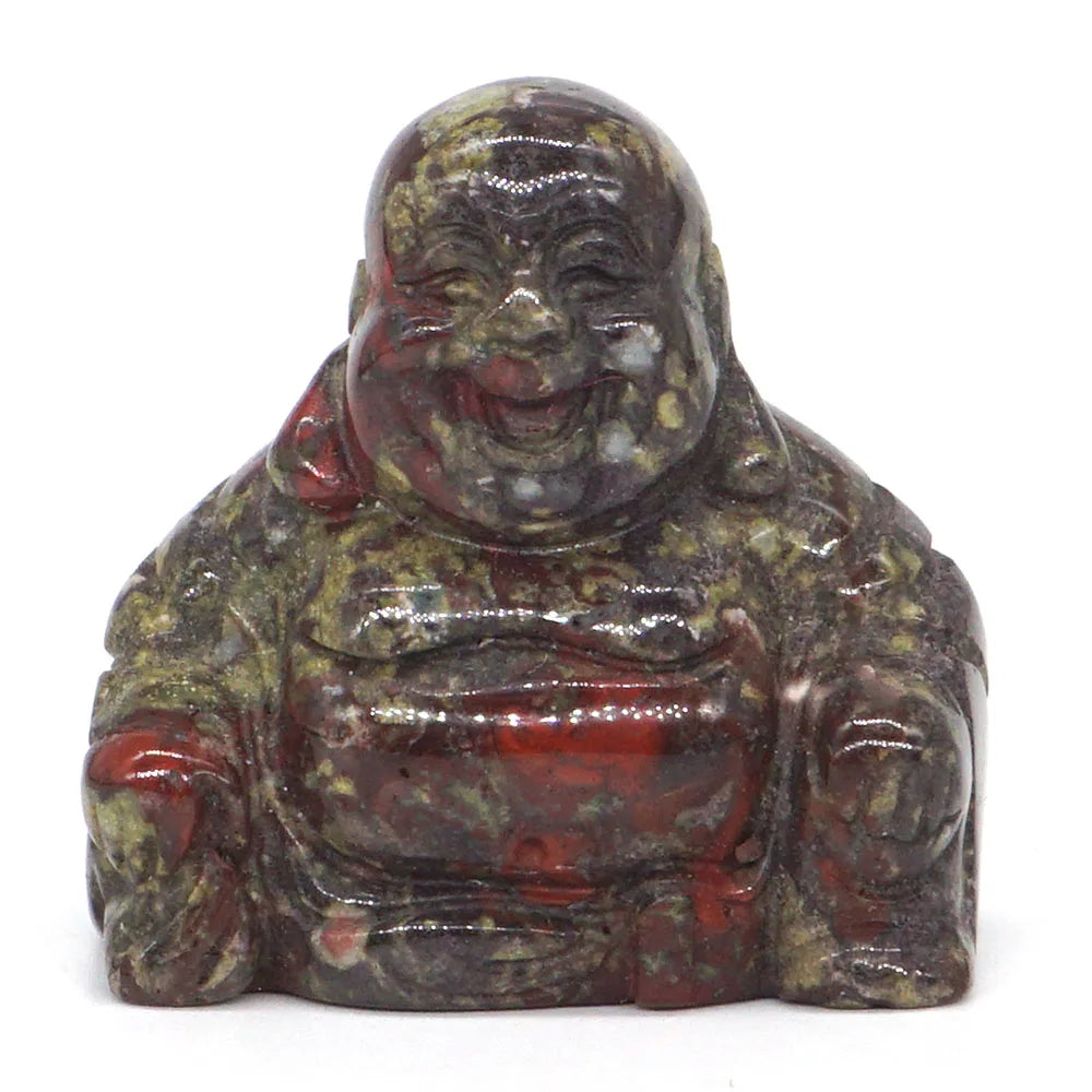 Polychrome stone Buddha figurine on a white background