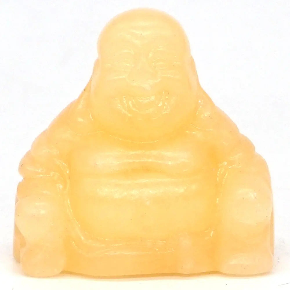 Yellow jade Buddha statue on a white background