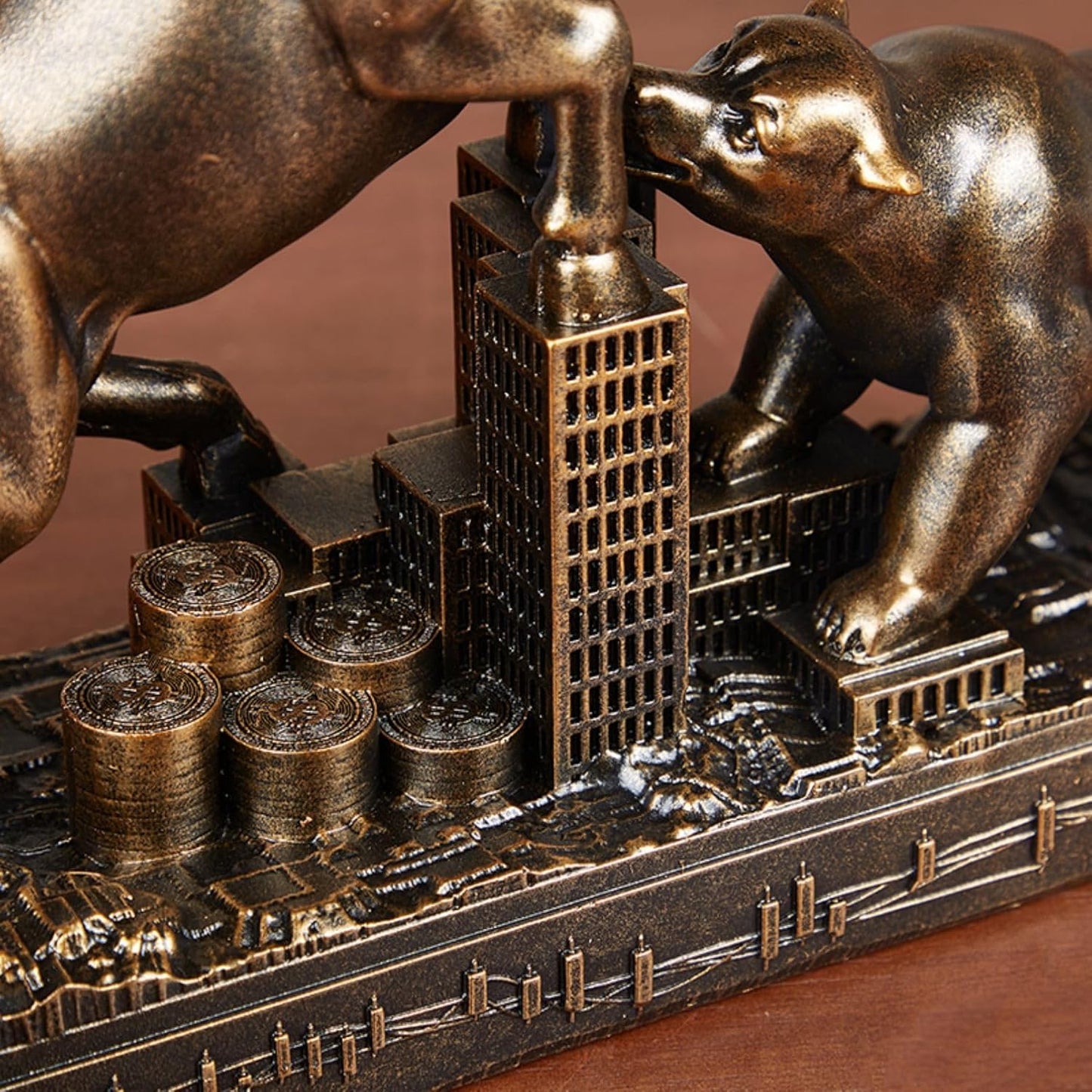 Close up of bronze bull and bear stock Market desk statue.