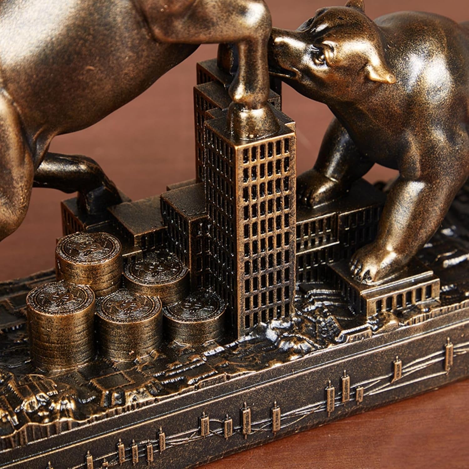 Close up of bronze bull and bear stock Market desk statue.
