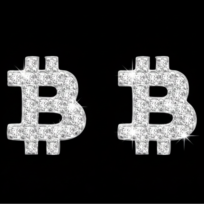 A pair of Bitcoin-shaped stud earrings covered in sparkling clear stones, set against a solid black background.