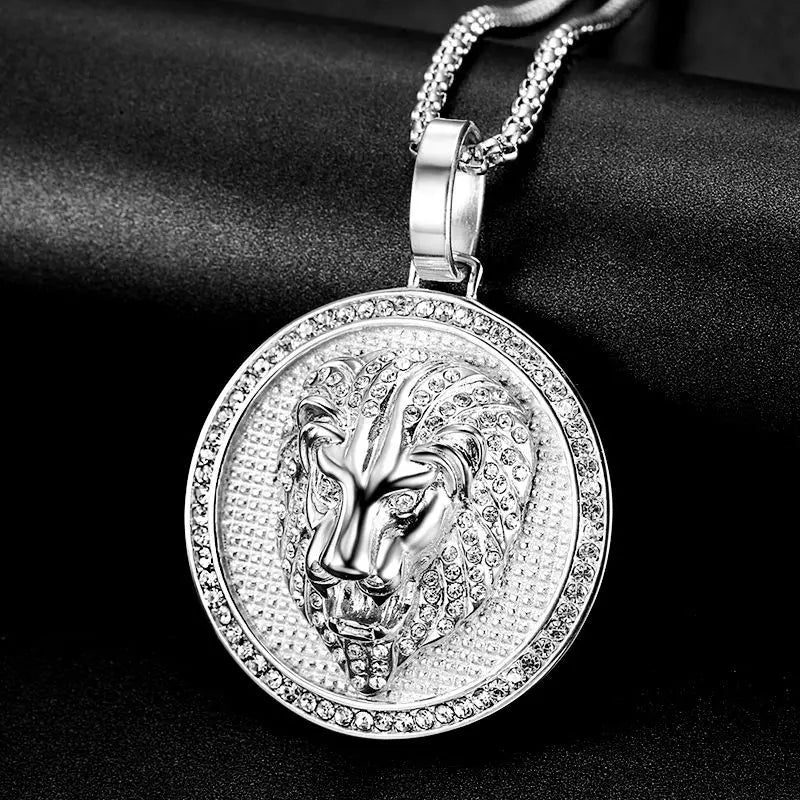 Silver pendant with intricate design on a black background