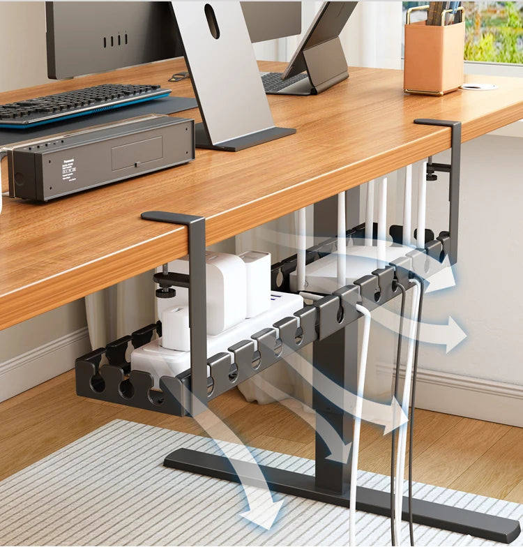 Under-desk cable management system with office equipment on a desk.