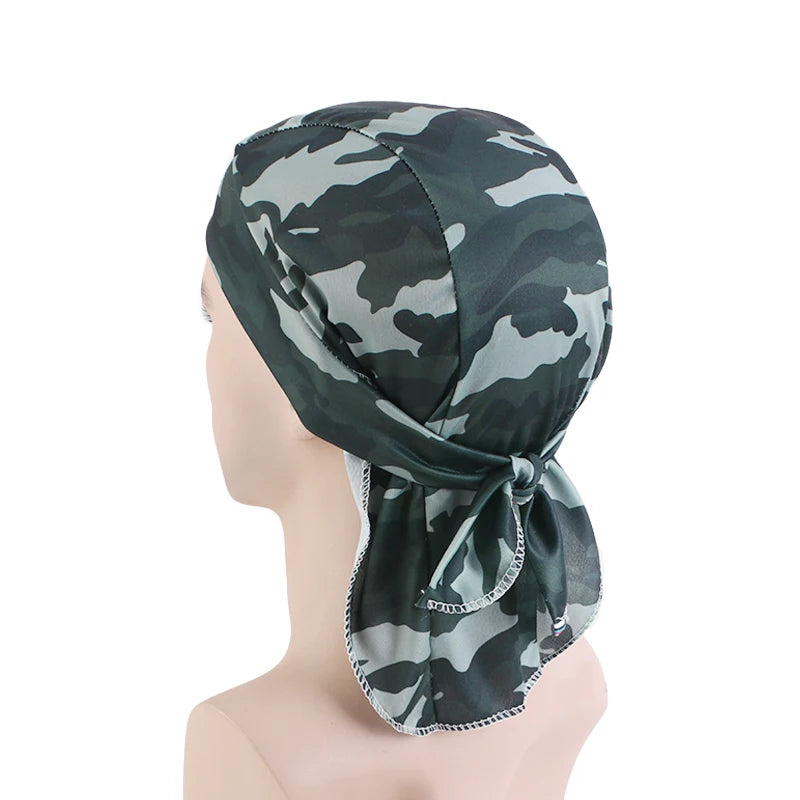 Camouflage-patterned headscarf on a mannequin head against a white background