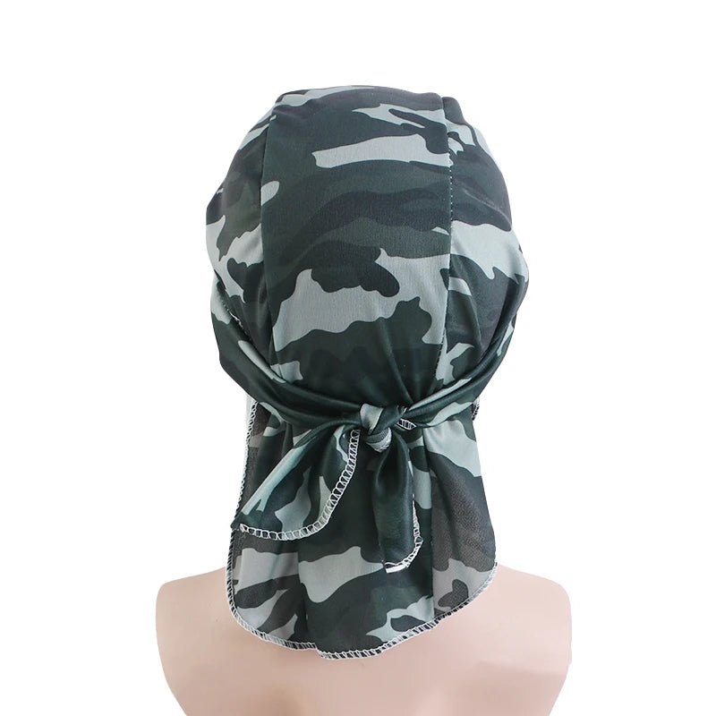Camouflage headscarf on a mannequin head against a white background