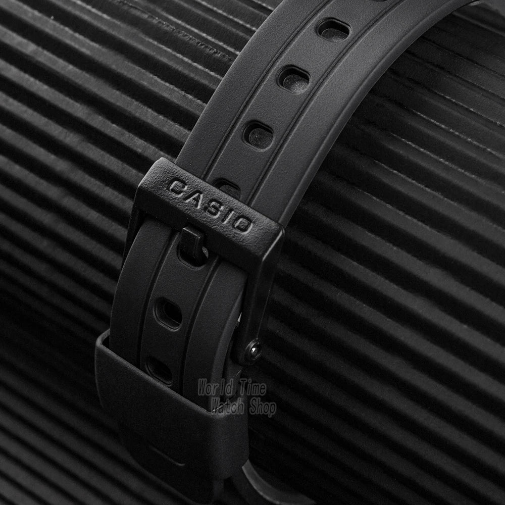 Black Casio watch strap on a textured black background