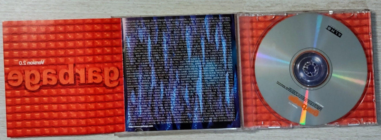 CD with red and black cover featuring text and a logo