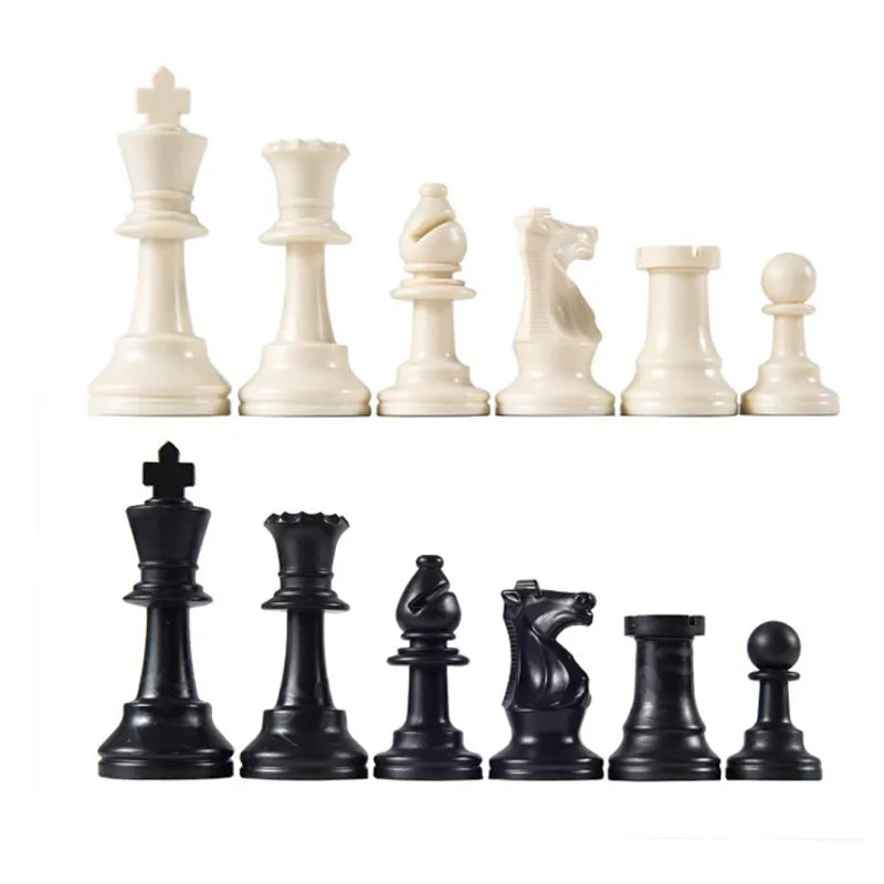 Set of black and white chess pieces on a white background