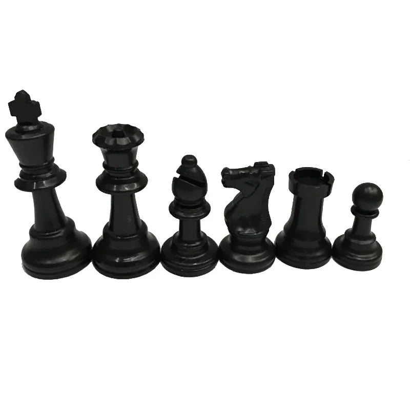 Set of black chess pieces on a white background