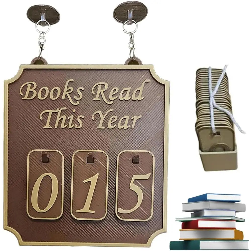 Decorative sign with 'Books Read This Year' and number '015', accompanied by books and a stack of books.