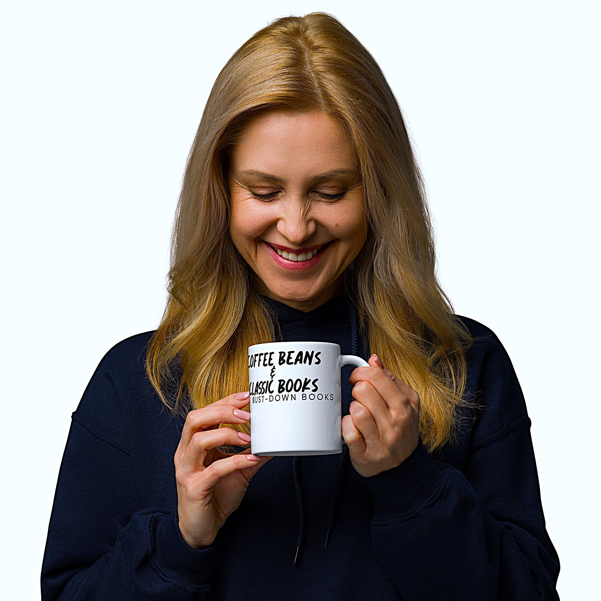 Woman shown smiling looking down at her Bust-Down Books "Coffee Beans & Classic Books" glossy white coffee mug.