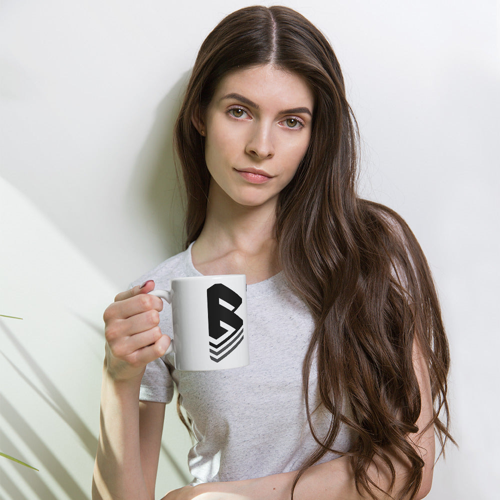 Woman posing with the Bust-Down "coffee beans and classic books" white coffee cup by Bust-Down.
