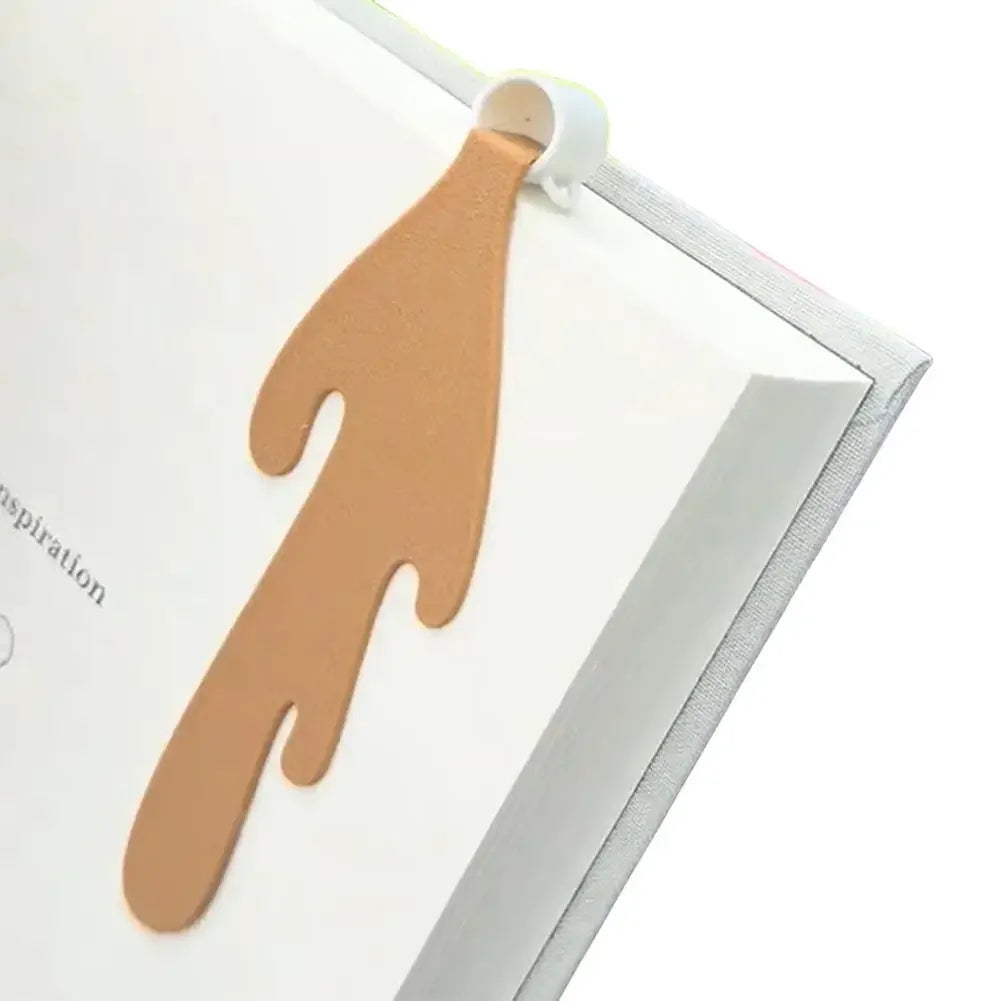 Bookmark with coffee spilling on page it's marking.