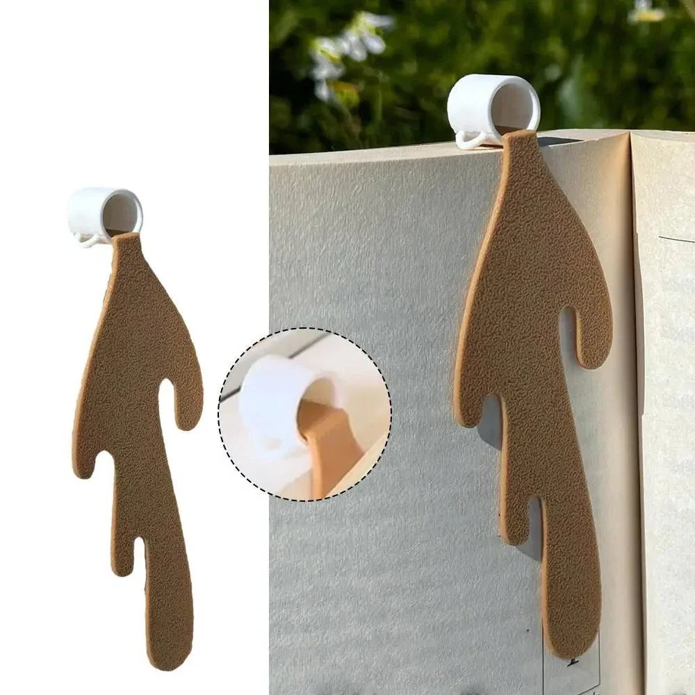 Bookmark of whip coffee cup spilling cartoon coffee over the page of the book the bookmark is marking. 