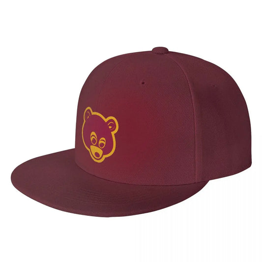Maroon 'College Dropout Kanye Snapback: Bear Mascot OSFA 9-Colorways' cap with yellow bear logo on a white background at angle.
