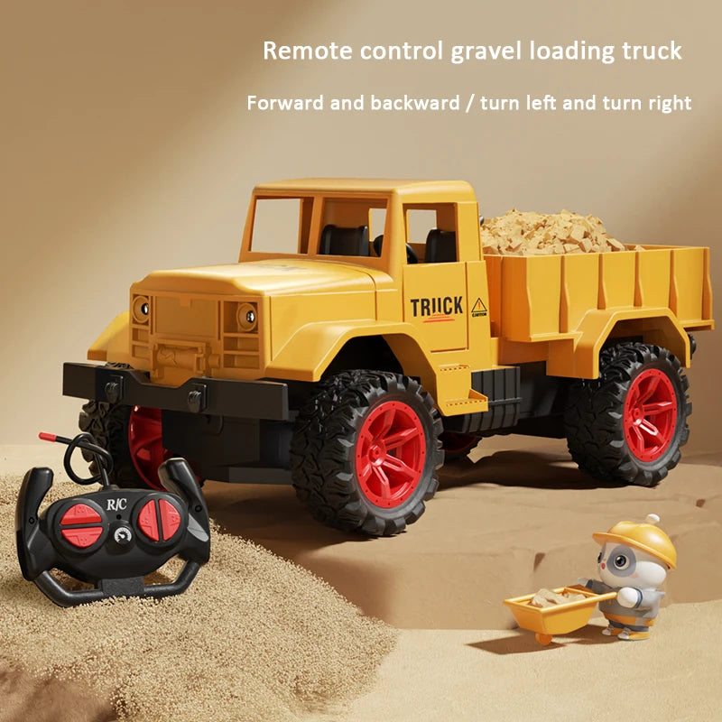 Toy gravel loading truck with remote control on a sandy background