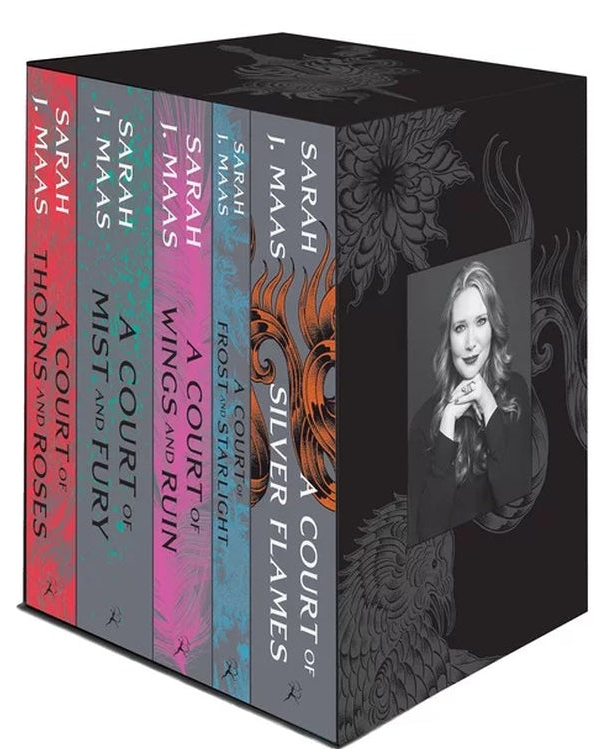 A boxed book set for Sarah J. Mas's 'A Court of Silver Flames' series, featuring five distinct colored spines in red, pink, purple, blue, and gray, with a black cover decorated with a silver dragon and a portrait of the author.