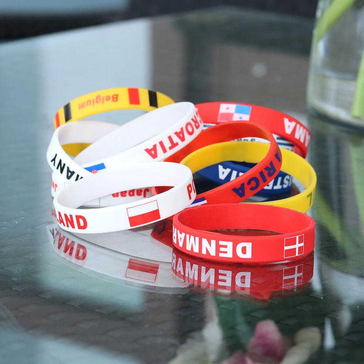 Assorted country silicon wristbands, with the featured 'Croatia' bracelet amongst other countries in similar design.