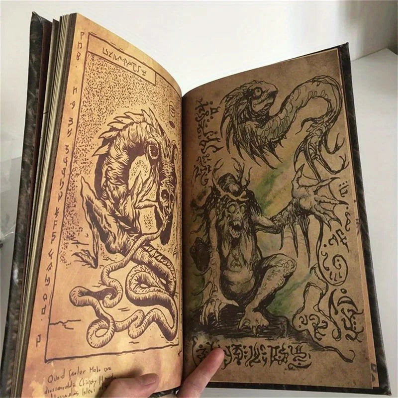 Open book with illustrations of dragons and other mythical creatures on a white background
