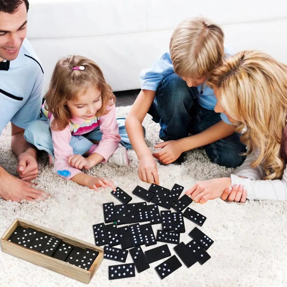 Family playing with dominoes on a carpeted floor