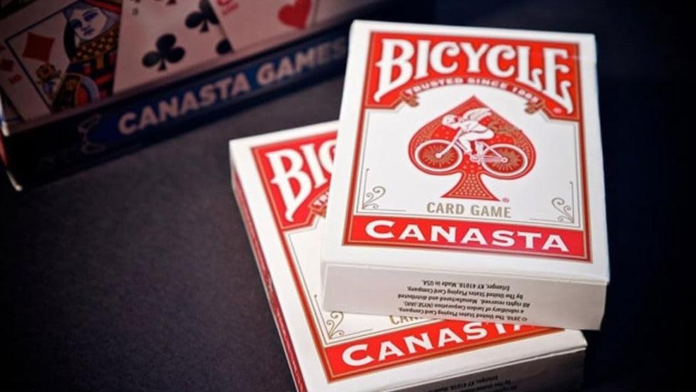 Bicycle Canasta card game packaging on a dark surface