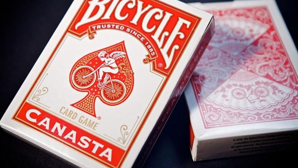 Bicycle Canasta card game packaging on a dark surface