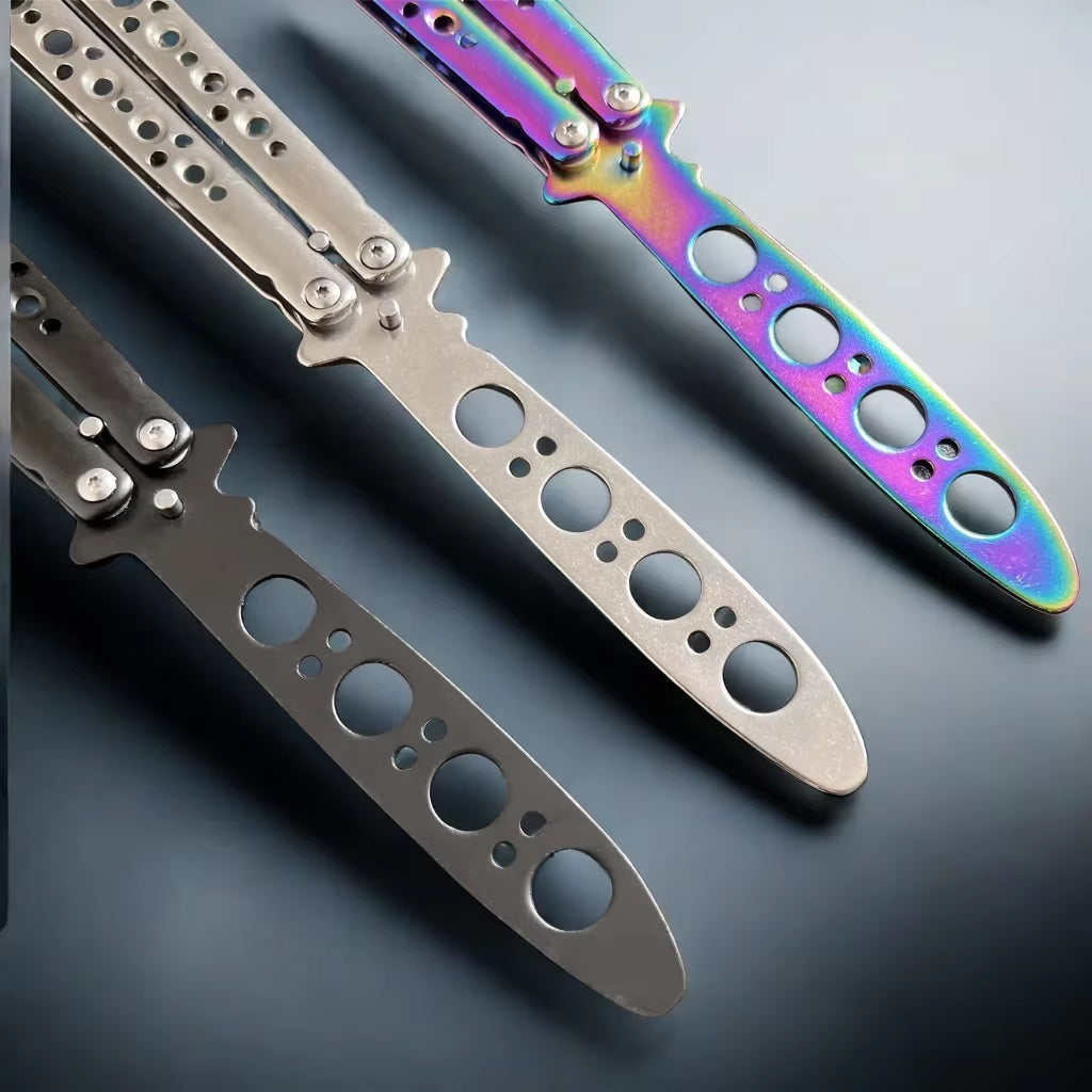 Three butterfly knife trainers with a dull blades and a handle designed for safe practice, featuring closeup of blade tips