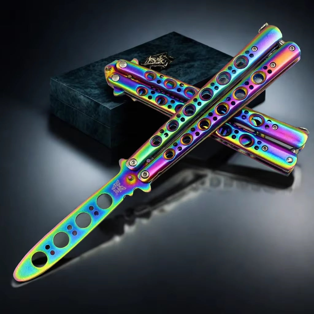 A chameleon-colored butterfly knife trainer with a dull blade and multiple holes in the handle for grip or handling.