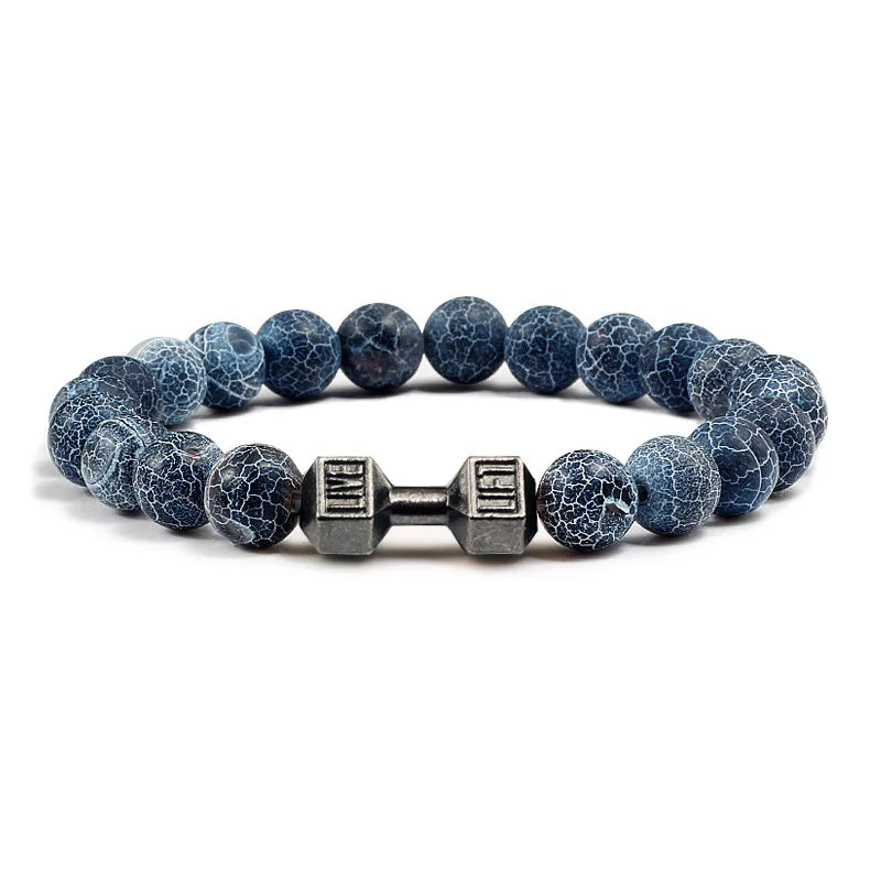 Blue marbled beaded bracelet with a metal dumbbell charm on a white background