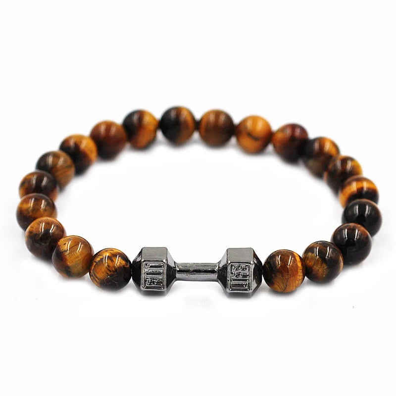 Bracelet with tiger eye beads and a metal dumbbell charm on a white background