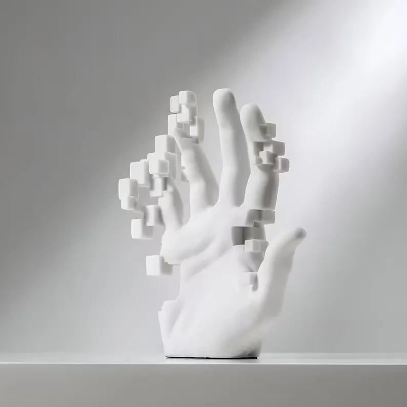 White abstract sculpture of a hand on a gray background