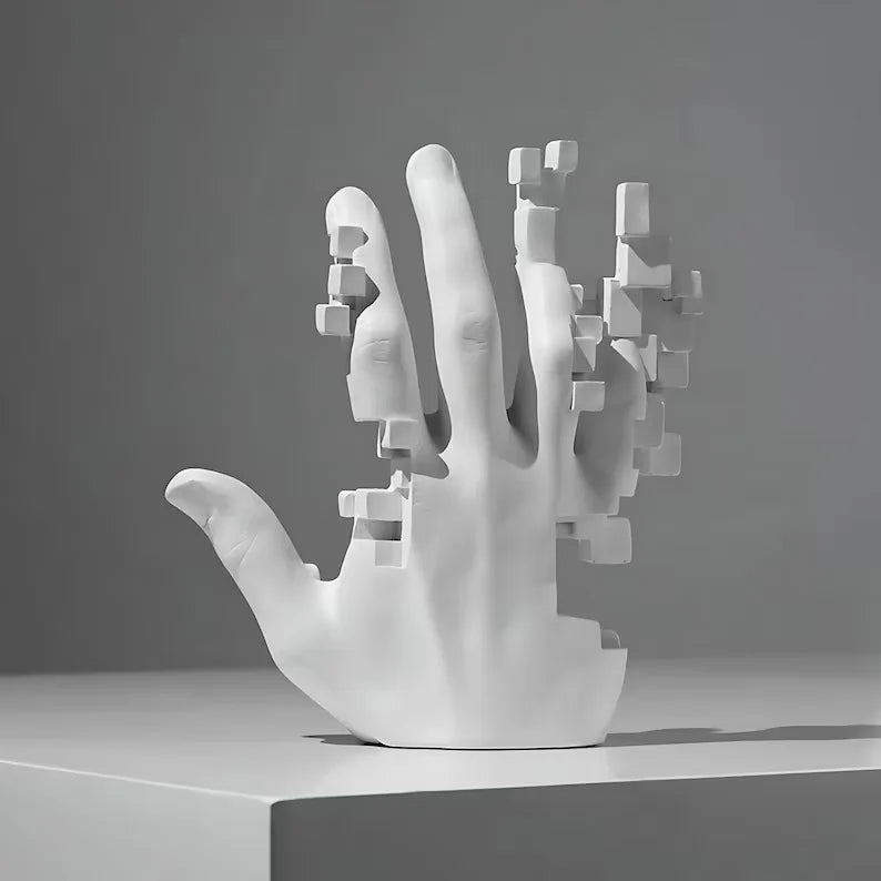 White abstract hand sculpture on a gray background