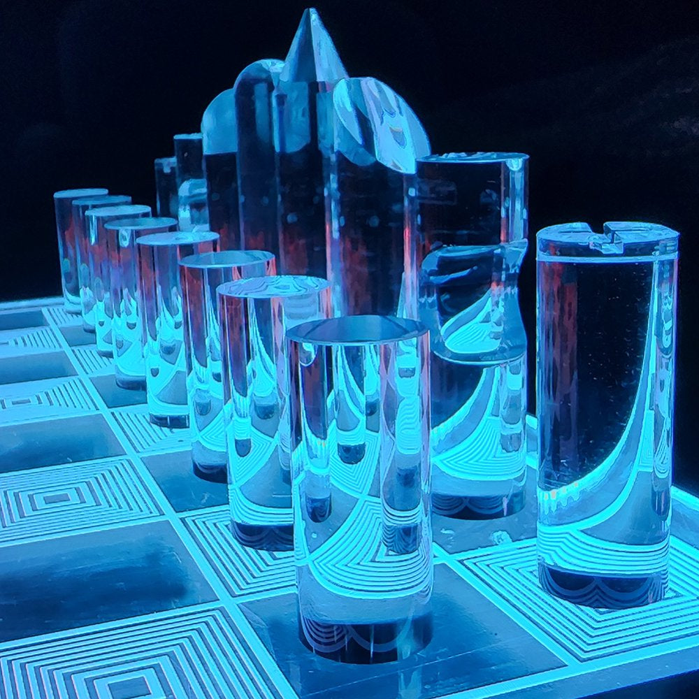 Close-up of the 3D translucent chess pieces catching the under-lighting of the board.