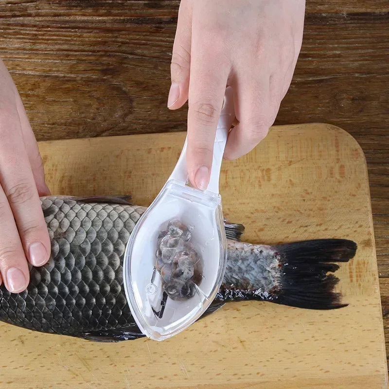 Person using a tool to remove fish flesh on a wooden cutting board