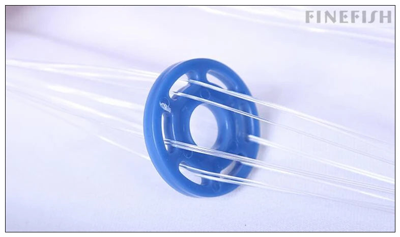 Blue fishing sinker with white strings on a light blue background, featuring the brand 'FINEFISH'.