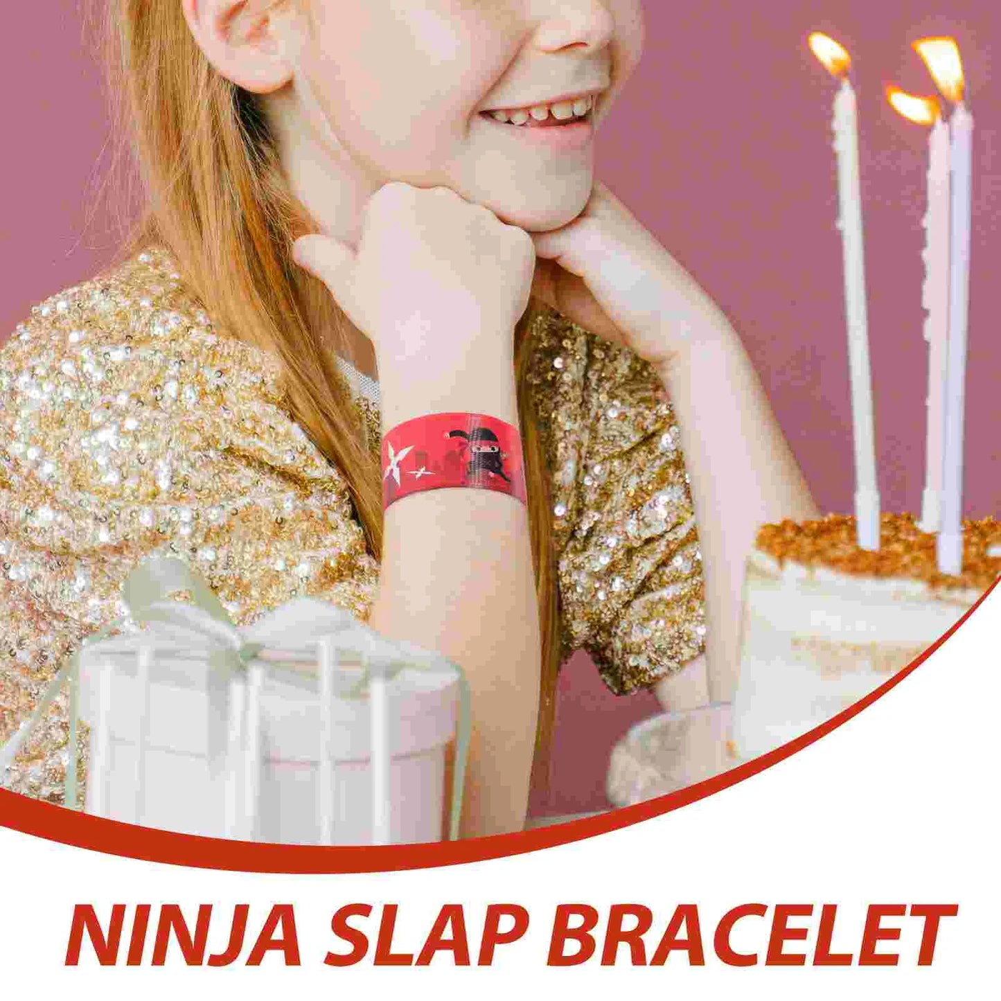 Child wearing a red 'Ninja Slap Bracelet' with a birthday cake and candles in the background.