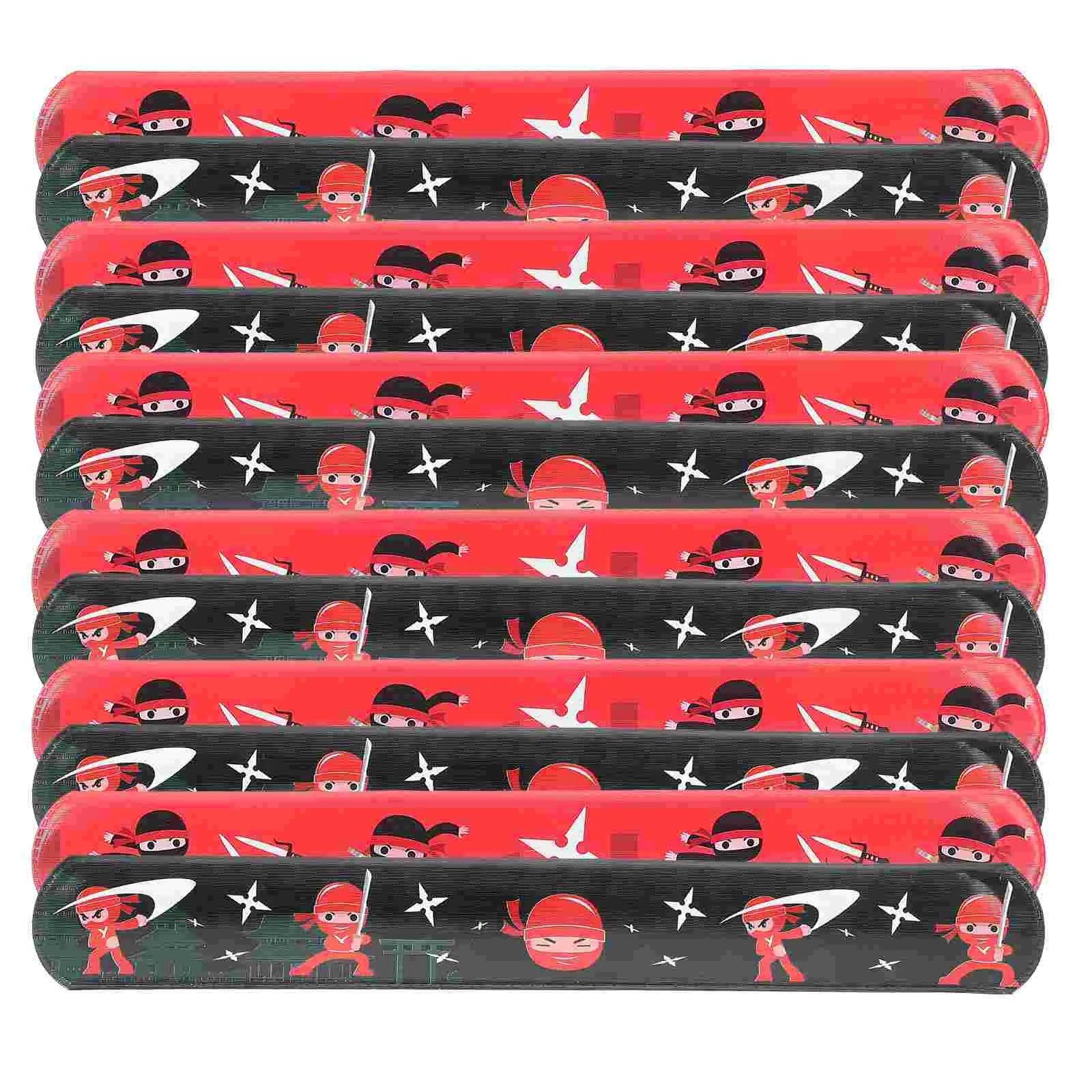 Multiple red and black slap bracelets with cartoon character design on a white background