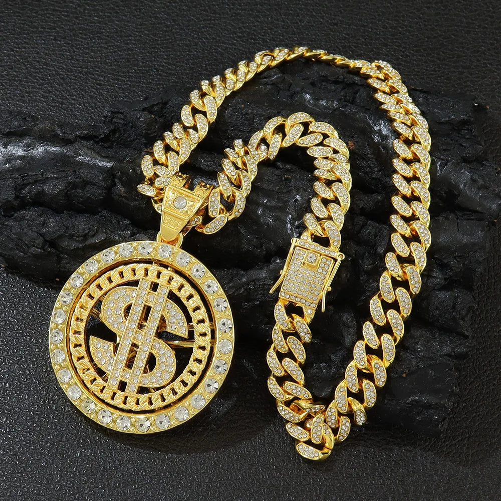 Gold chain necklace with dollar sign pendant on a dark textured background